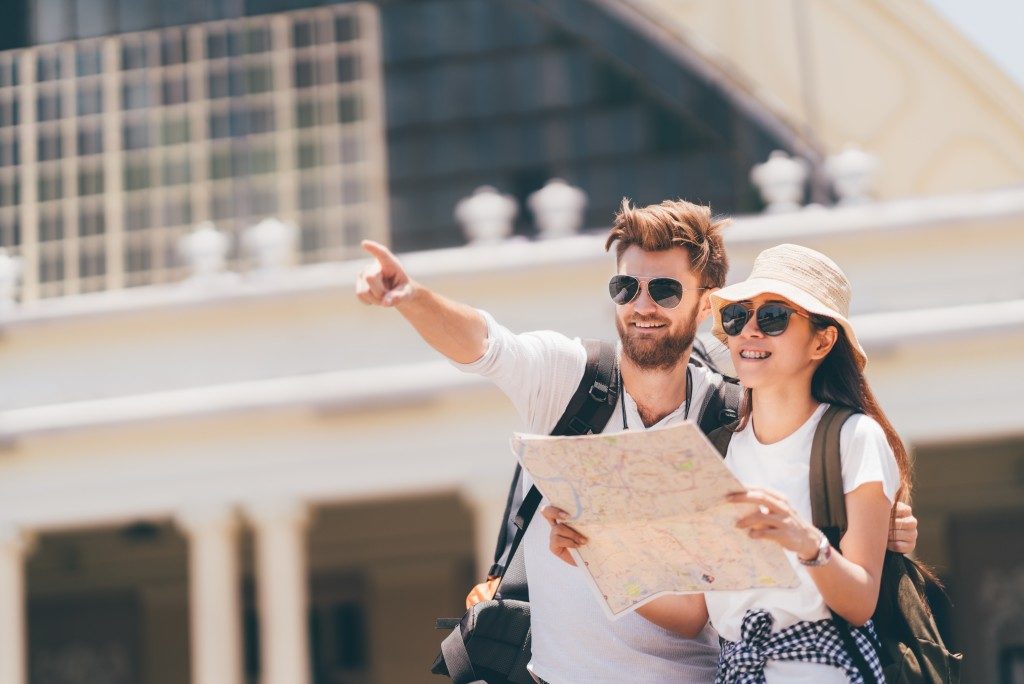 couple navigating map during vacation